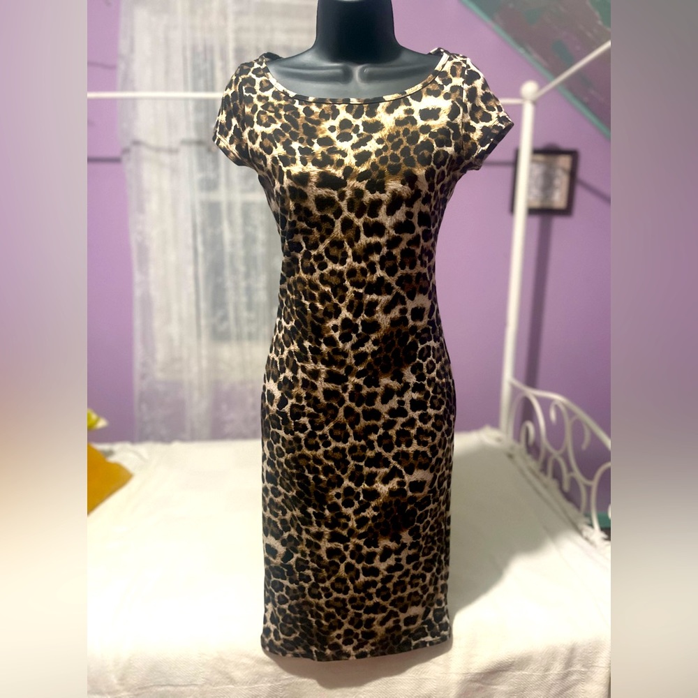 Elegant LA Breeze Leopard Dress Flattering length and ruching. Dress up or down